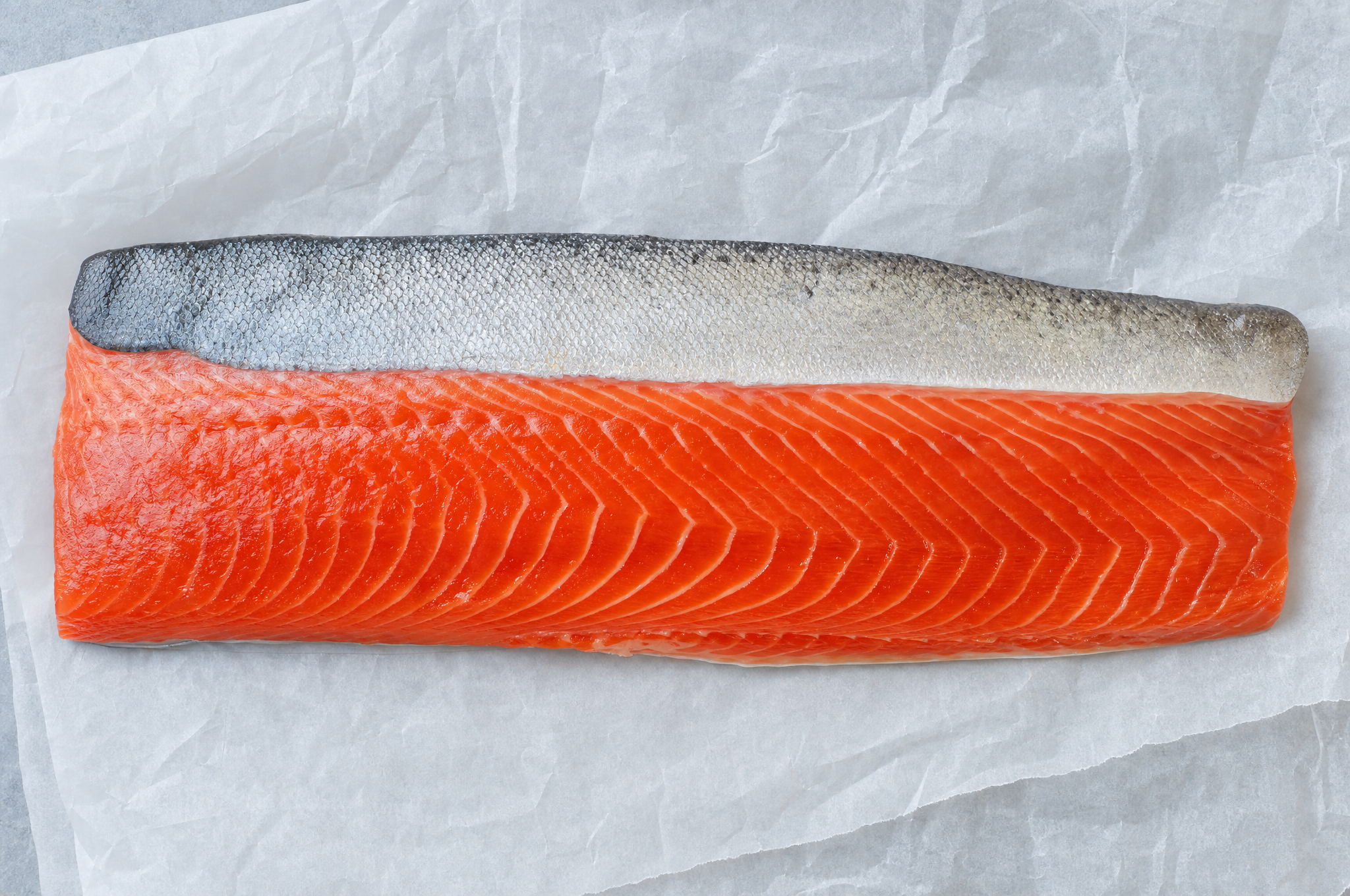 Wild king salmon fillet on parchment