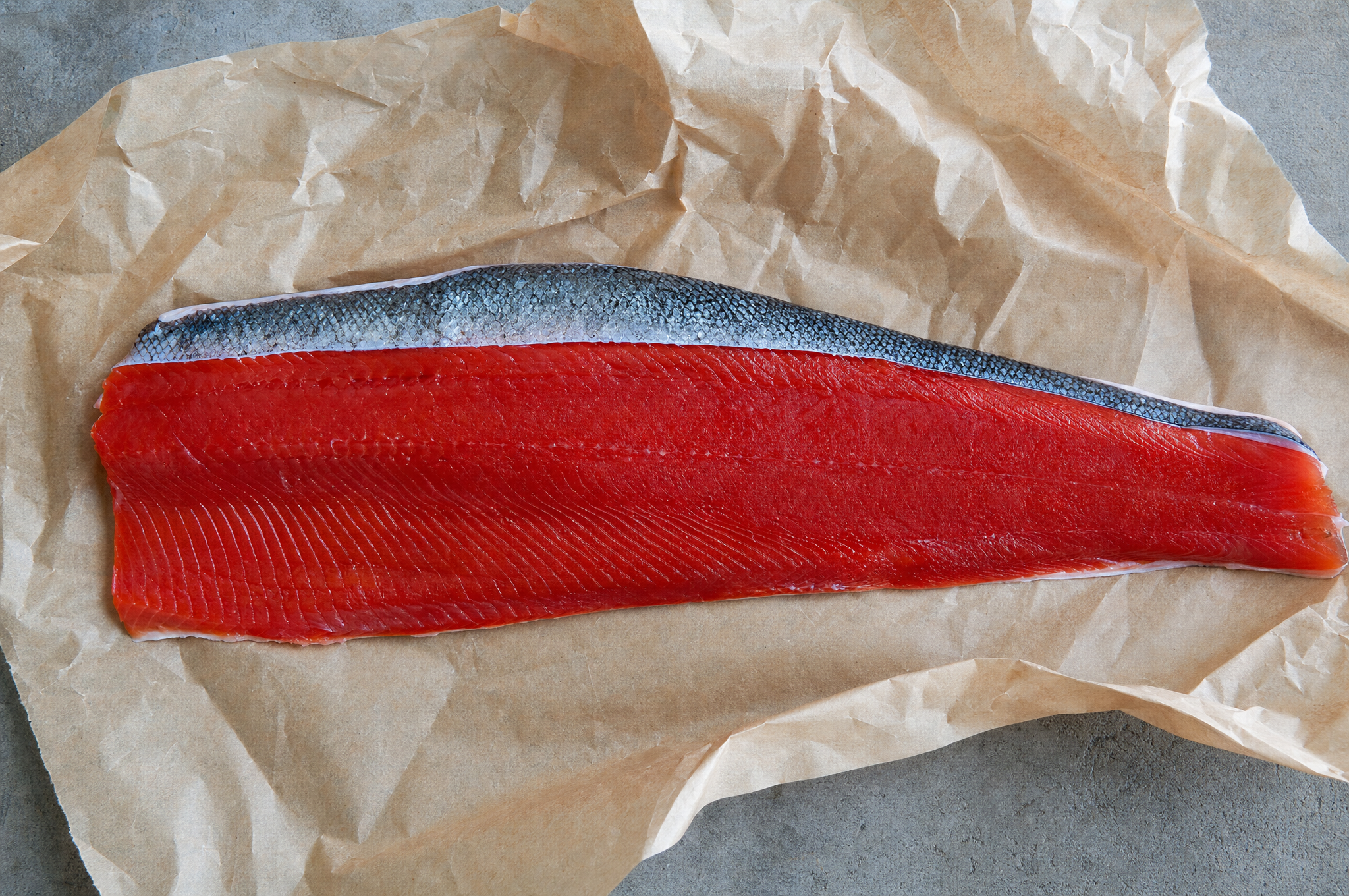 Wild sockeye salmon fillet on parchment