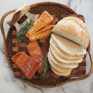 two smoked sockeye salmon portions on a charcuterie board