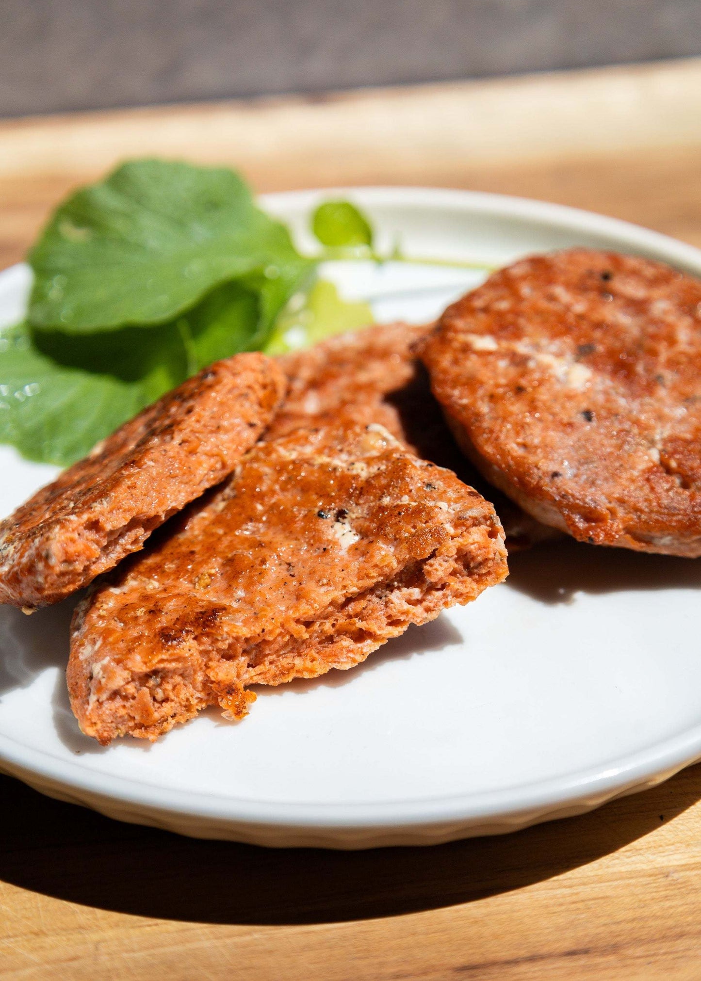 inside of a delicious cooked wild sockeye salmon sausage patty