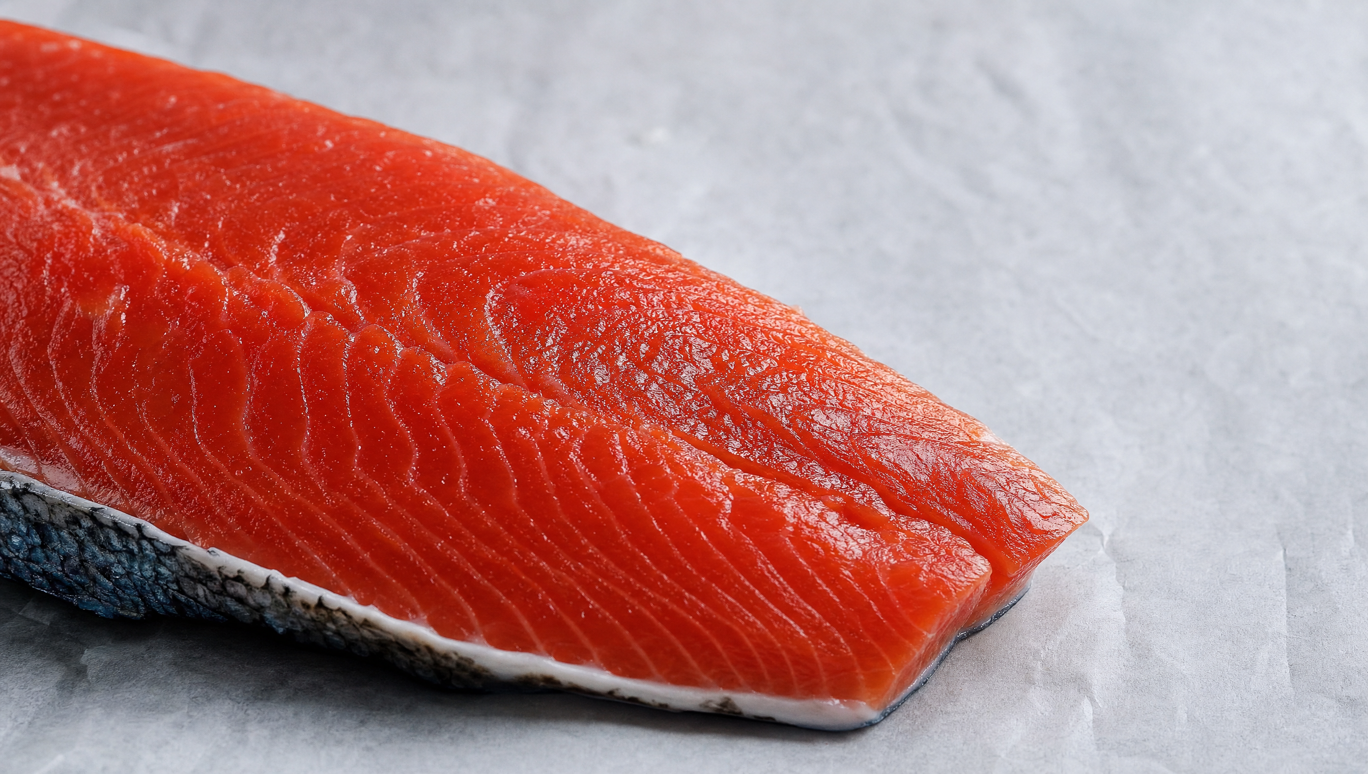 Raw sockeye salmon fillet showing rich red flesh